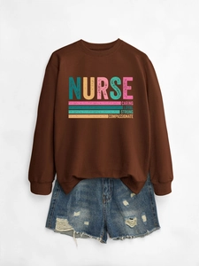 Detail of dark brown nurse sweatshirt with vintage print and distressed denim shorts