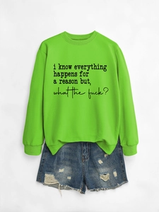 Flat lay of neon green crewneck sweatshirt with text and distressed denim shorts set