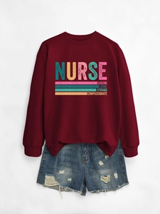 Detail of burgundy sweatshirt with Nurse lettering paired with ripped denim shorts