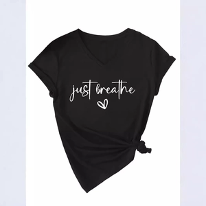 Women's black V-neck short sleeve T-shirt featuring a just breathe heart print and side knot