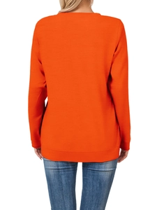 Back view of orange long sleeve t-shirt with ribbed crew neck and cuffs on a model
