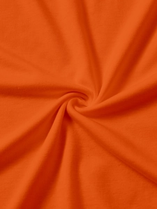 Close-up of vibrant orange knitted fabric texture showing fine jersey stitch and soft drape