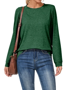 Detail of dark green long sleeve crewneck top paired with casual vintage jeans