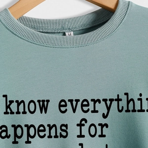 Mint green crewneck sweatshirt with Everything Happens for a Reason printed on chest