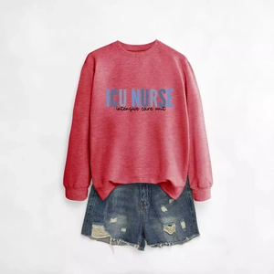 Red long sleeve ICU nurse crewneck sweatshirt styled with distressed blue denim shorts