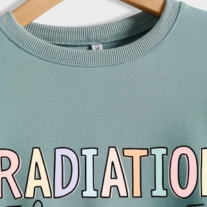 Green radiation therapist crewneck sweatshirt featuring colorful letters and ribbed collar