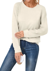 Close-up of cream crew neck sweatshirt with fine ribbed texture and soft knit fabric