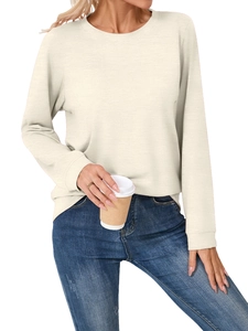 Detail of soft knit cream long sleeve T-shirt styled with blue jeans for casual wear