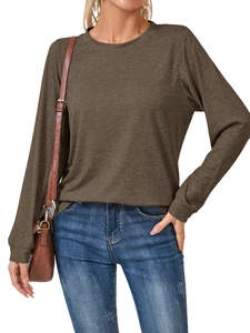 Detailed texture of brown long sleeve crewneck top with ribbed cuffs and casual fit