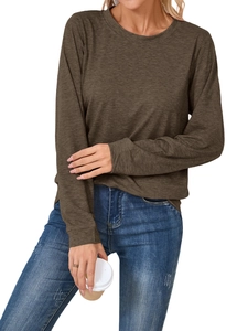 Detail of long sleeve crew neck T-shirt fabric texture and casual fit on a model