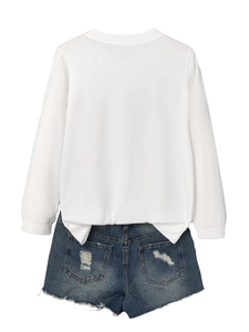 Detail shot of a white cotton long sleeve T-shirt with side slits and denim shorts