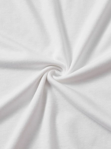 Detailed close-up of soft white cotton fabric with elegant spiral texture and drape