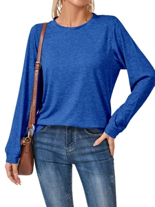 Royal blue long sleeve crewneck top for women paired with washed denim jeans
