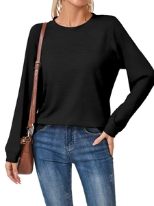 Detailed view of women's black long sleeve crew neck tee with subtle ribbed texture