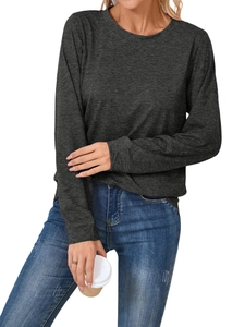Detail of dark grey long sleeve crewneck top paired with classic blue washed denim jeans