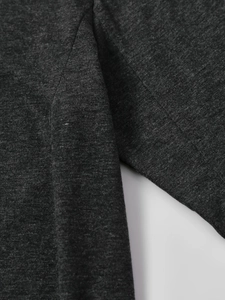 Close-up of precision stitching on dark grey heather long sleeve T-shirt sleeve