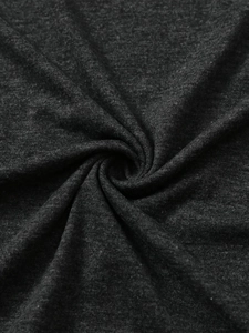 Macro shot of heather grey knitted fabric showing soft texture and premium weave detail