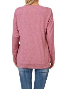 Detail of pink heathered long sleeve sweatshirt with ribbed hem and loose fit for women