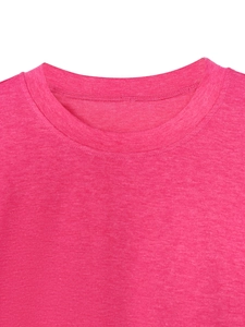 Detail of crew neck collar with double-needle stitching on rose red textured fabric