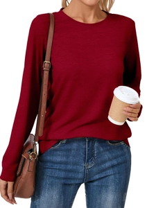 Close-up of casual long-sleeved dark red knit top styled with a brown leather bag