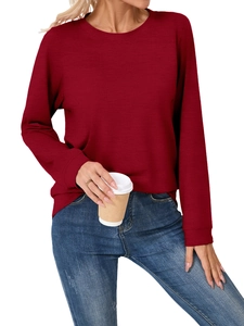 Close-up of deep red long-sleeved crew neck top showing fine horizontal fabric texture