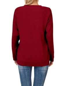 Detail view of the ribbed cuffs and hem on this burgundy crewneck long sleeve sweatshirt