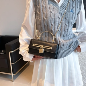 Elegant black crocodile pattern crossbody bag with gold heart lock and chain strap