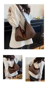 Détail macro d'un grand sac hobo en cuir souple marron foncé avec bandoulière réglable
