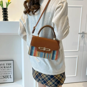 Stylish bicolor underarm bag with rainbow woven texture and adjustable shoulder strap