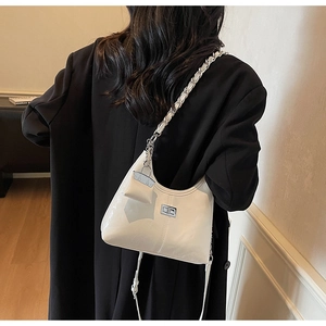 White patent leather hobo bag featuring silver chain strap and mini pouch detail