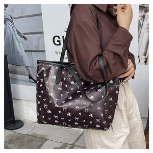 Outdoor model shot of large floral tote bag with butterfly patterns for daily commute