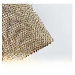 Detailed macro view of champagne gold woven texture and fine metallic mesh craftsmanship