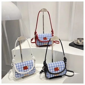Three gingham crossbody bags with apple embroidery shown in red, white and black options