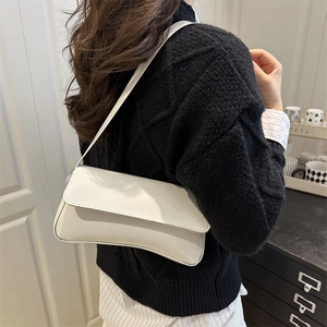 Glossy white PU leather small crossbody bag for women shown with a casual shoulder style