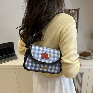 Mini blue plaid crossbody saddle bag with red apple embroidery and slim black shoulder strap