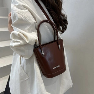 Minimalist burgundy bucket bag with FASHION lettering for shoulder or crossbody wear