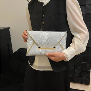 Elegant white snakeskin envelope clutch with gold metal trim for evening gala use