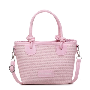 Pink woven bucket bag with top handle and adjustable shoulder strap on white background