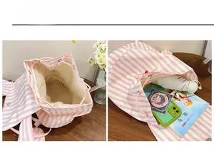 Pink and white striped backpack interior view showing large capacity for books and umbrella