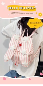 Detail of pink striped backpack with plush stars and drawstring closure on a model