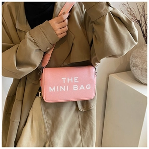 Pink lychee grain leather mini crossbody bag with letter print and fabric shoulder strap