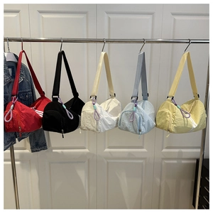 Nylon oxford sport bags in five colors with side stripes and bottom zipper compartment
