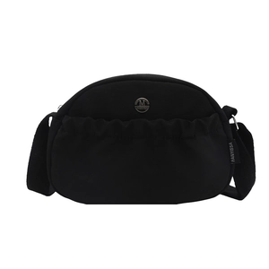 Urban chic black pleated nylon crossbody bag with circular M logo on a white background