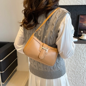 Fashionable light brown leather underarm bag for women with golden metal buckle decoration