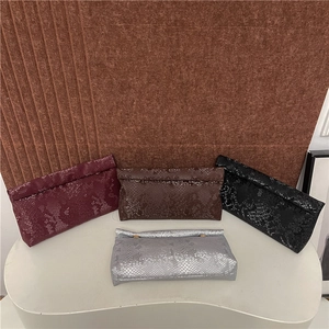 Elegant snake-patterned clutch bags in burgundy, coffee, black, and silver finishes