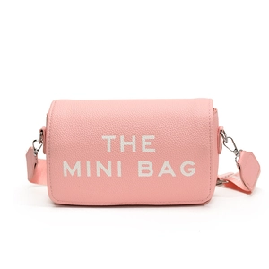 Pink mini crossbody square bag with wide strap and white THE MINI BAG lettering