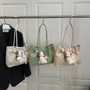 Chic woven texture tote bags in beige, green, and pink with cute dog plush charms