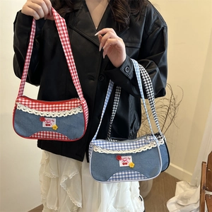 Lace-trimmed denim hobo bag in red and blue plaid patterns with cherry patch detail