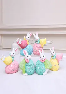 Close-up of resin Easter bunnies on lace textured egg bases with rhinestone details