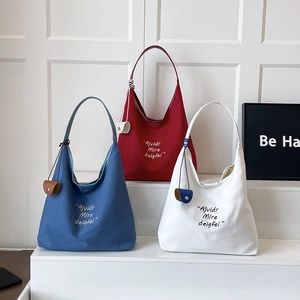 Canvas hobo tote bag with letter embroidery and small pouch in blue, red, and white